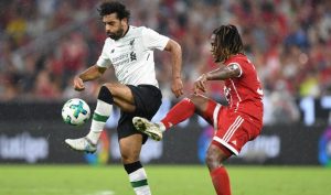 Liverpool's Egyptian striker Mohamed Salah (L) and Bayern Munich's Portuguese midfielder Renato Sanches (R) vie for the ball during the second Audi Cup football match between FC Bayern Munich and FC Liverpool in the stadium in Munich, southern Germany, on August 1, 2017.  / AFP PHOTO / Christof STACHE